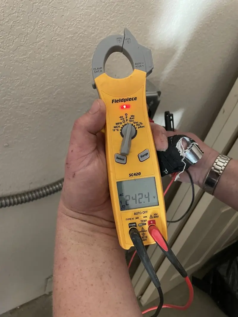 Voltage testing with clamp meter during Recessed Lighting Installation in Lackawanna